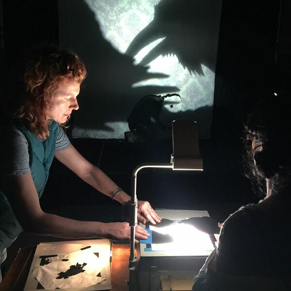 Valeska and Lisa working puppets on the projectors