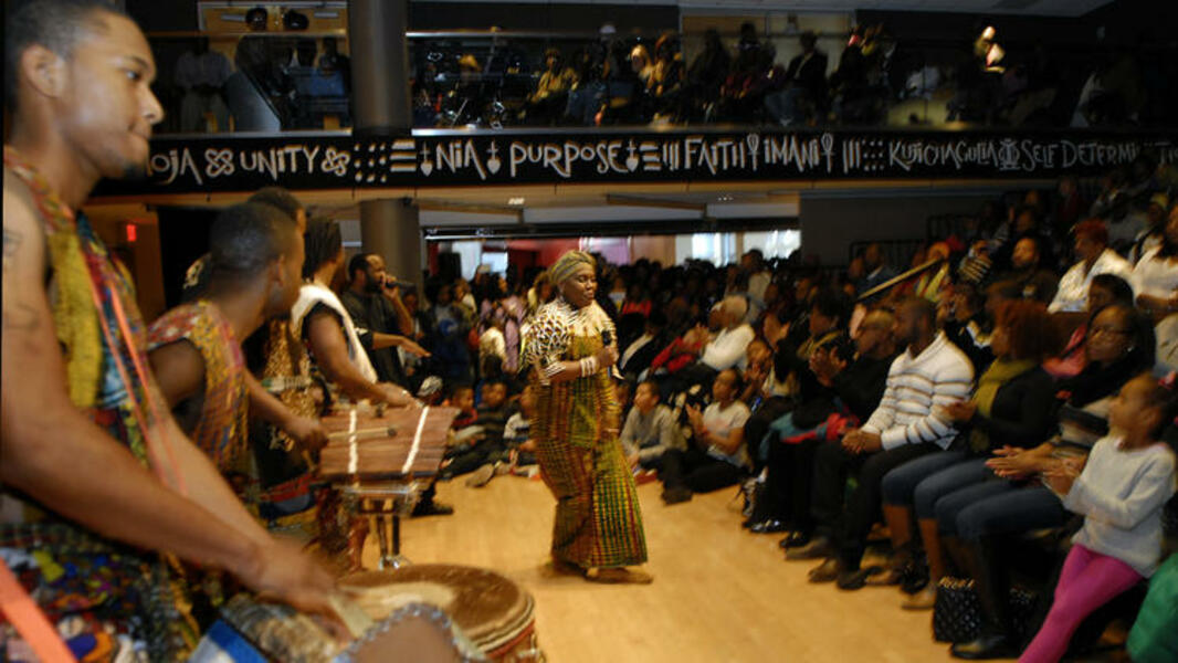 Kwanzaa Celebration with Founder of Kwanzaa Dr. Maulana Karenga @ The Reginald F. Lewis Museum, with musical guests Sankofa Dance Theater & Shodekeh. Photo by the Baltimore Sun, 2013.