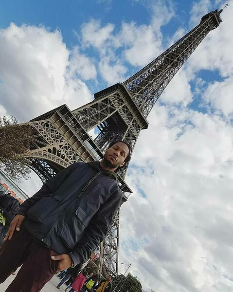 Ill Conscious in front of The Eiffel Tower