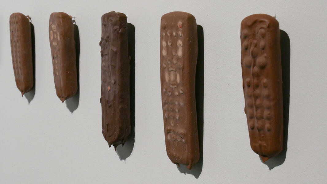 At or Near the Melting Point, (2017-2018), chocolate dipped TV remotes