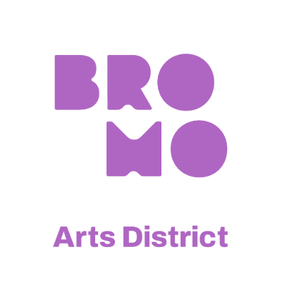 Logo: stacked purple designed letters BROMO over Arts District, written in simple font