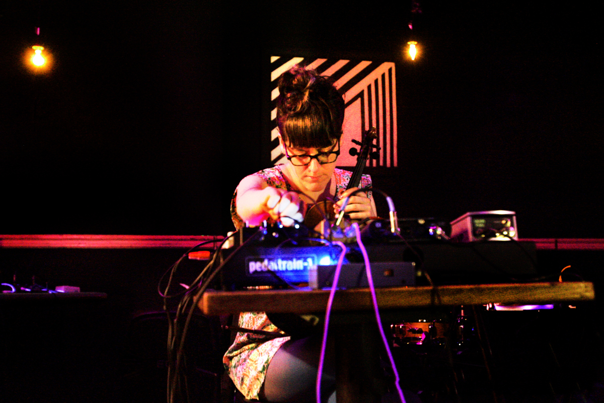 Liz Meredith solo performance: violin/electronics. Baltimore MD, 2014.