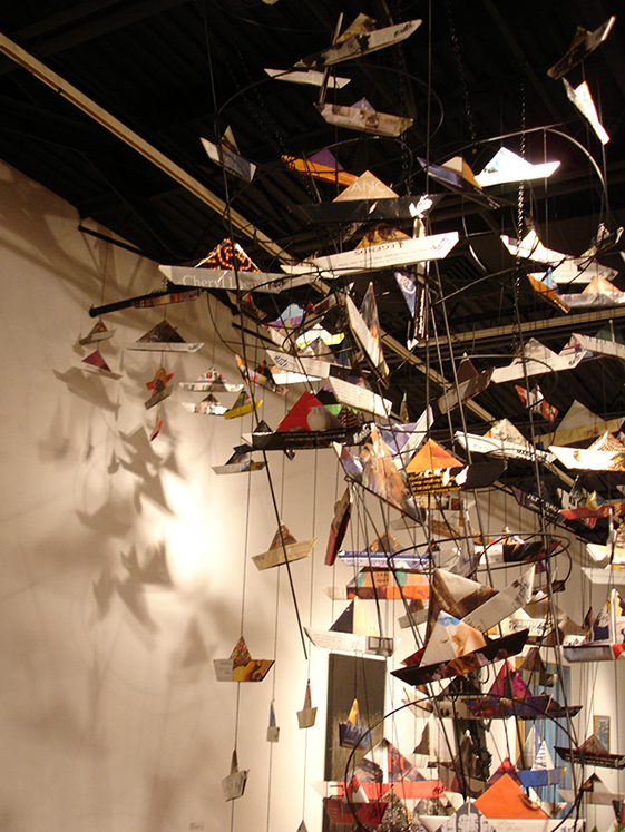Shadows on the wall and movement of some of the boats give an extension and liveliness to the Maelstrom Installation at the Howard County Center for the Arts in December of 2014