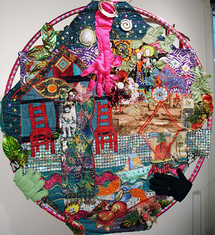 Other side of "hula hoop quilt" self-portrait. Fabric and collected memorabilia, quilted and supported on hula hoop.  Nov 2013