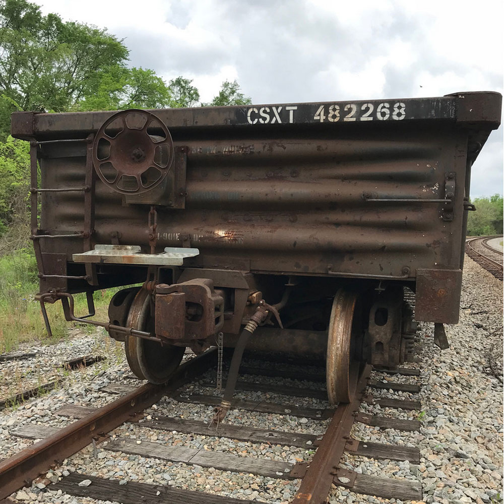 a photograph of an old train car on tracks, taken by Jennifer N. Shannon