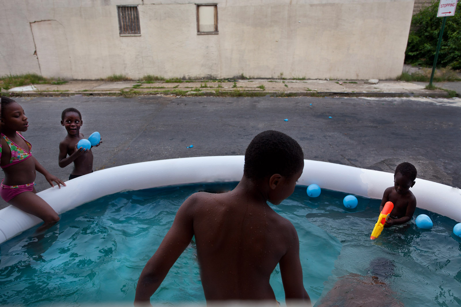 photograph of boys in wading pool