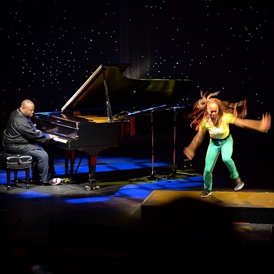 Color image of Scott Patterson and Camille A. Brown performing