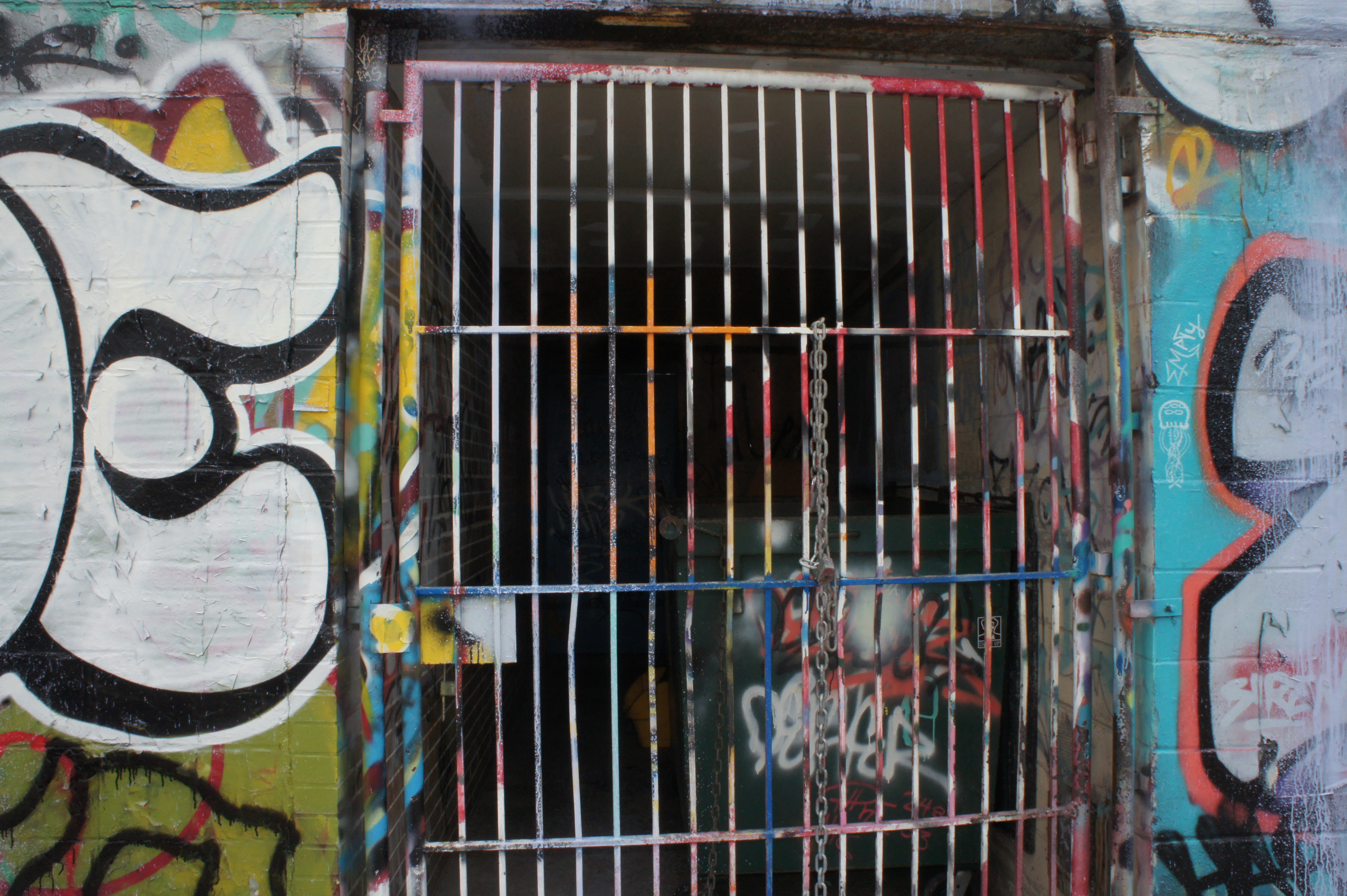 a photograph of bars and graffiti taken by Jennifer N. Shannon
