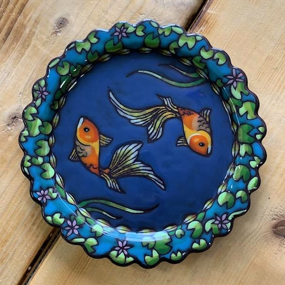Plate with painted images of goldfish and lilypads