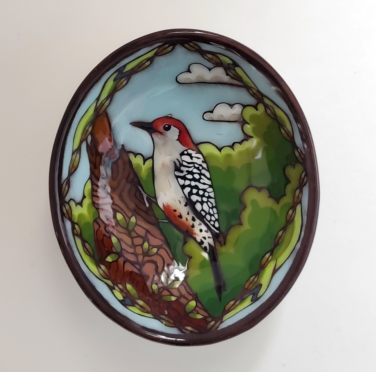 Bowl with a red-bellied woodpecker in the trees