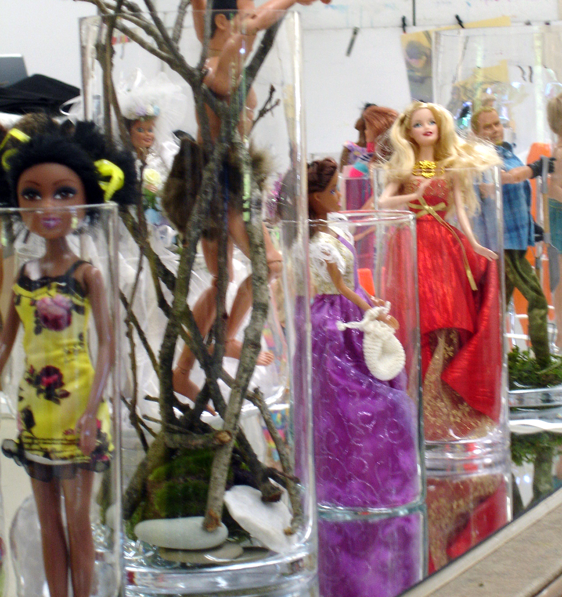 After canvasing second hand stores for glass cylinders and 12" dolls, I began to arrange them.