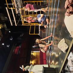 Actors learn to use masks in rehearsal