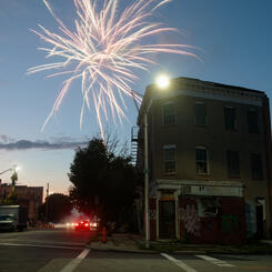 Fireworks burst in the air at an intersection in Upton.