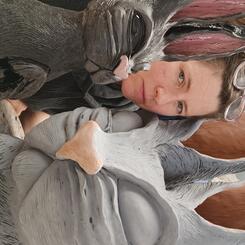 Self portrait with rabbit sculptures