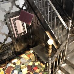 Glowing lamp globe with falling book