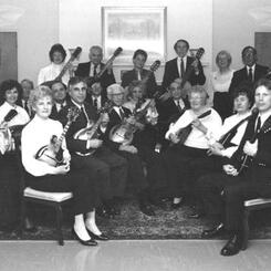 The Baltimore Mandolin Orchestra, 1988, with director David T. Evans (standing at left)