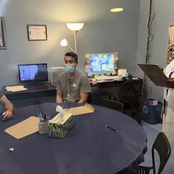 Audience and performers interact in the set of the Office in the Boundary.