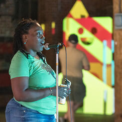 Gallery attendee interacting with the CRT Video Installation.