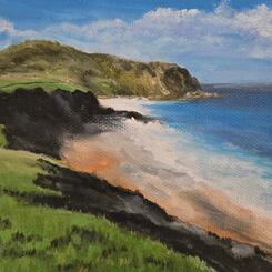 Seaside Cliffs, cloud filled sky with dark cliffs and ocean lapping on the beach.  Large hillside on the left with ocean on the right.