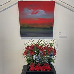 Red Kauai with floral arrangement inspired by the painting