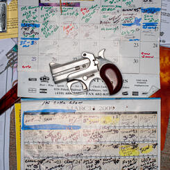 Calendar and a Derringer Pistol