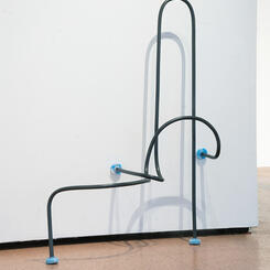 Speculative Grab Bars #2: Double Bend, 2023. PVC pipe, silicon, pigment, hardware, 52” x 42” x 30”