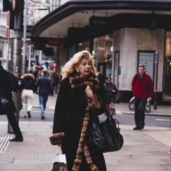Woman in a fur-trimmed coat, 2023