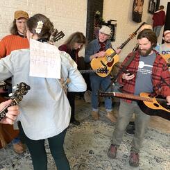 Kait with a chord chart taped to her back