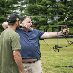Tracy Shoots While Eric Watches (Hosts of Archery Day)