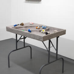 Play Party, 2018. Wood, concrete, latex, paper pulp, table legs.  35” x 24” x 30”