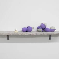 Play Party, 2018. Wood, concrete, latex, paper pulp, table legs.  35” x 24” x 30” 