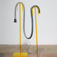 Alx Velozo Gray rbbr Cane, 2022. Silicone rubber, wire, lucite  40” x 15” x 20”