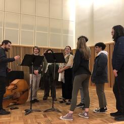 LIGAMENT talking with students on stage after their guest artist recital