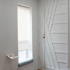 Chainlinked, 2025. Silicone, metal chain, carpet, spray paint, clipboards  16” x 16” x 168”