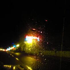 motel neon obscured in rain