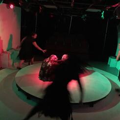 Witches in movement around a cauldron