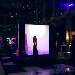 Sabine Kearley singing in silhouette