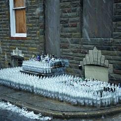 Snow bottle alter, pouring libations