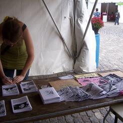 folding a zine while tabling at the zine pavalion @ Baltimore Bookfair