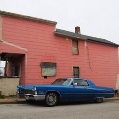 blue caddy, pink house