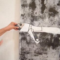 Applying clay shard to sumi-e ink painting