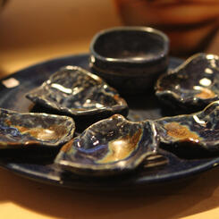 Oyster plate with dish for cocktail sauce