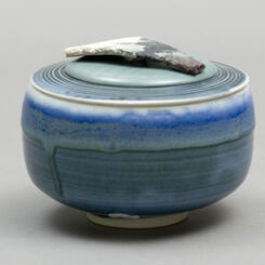 Container with clay/wood lid