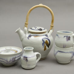 Porcelain teapot, mugs, sugar bowl, creamer