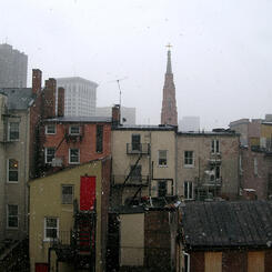 snowy gray city with one red door