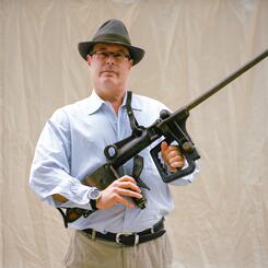 Man holding gun sculpture