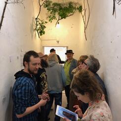 1.	A St. Petersburgh arts collective takes of the hallways of a gallery to show work.  They are about to de-install.