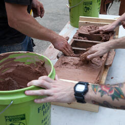 Making bricks at the Baltimore Mobile Community Brick Factory