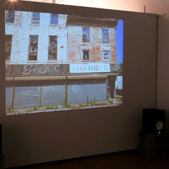 Installation view of gallery projection of BALTIMORE