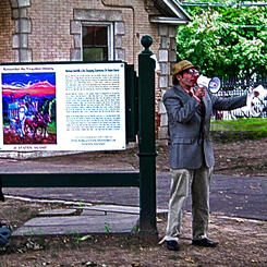 Photorecord of a live performance with the artist impersonating the controversial mythological, historian, Dr. D.I. Kniebocker, reading excerpts from the Forgotten History of Staten Island at the inaugural event for onsite installations September 17th, 20